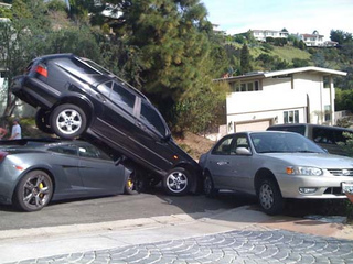 Illustration for article titled Lamborghini Gallardo Tangles With Many Parked Cars In LA's Laurel Canyon, Much Bondo Needed
